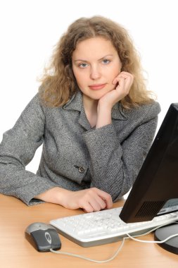 Woman in front of her desktop computer