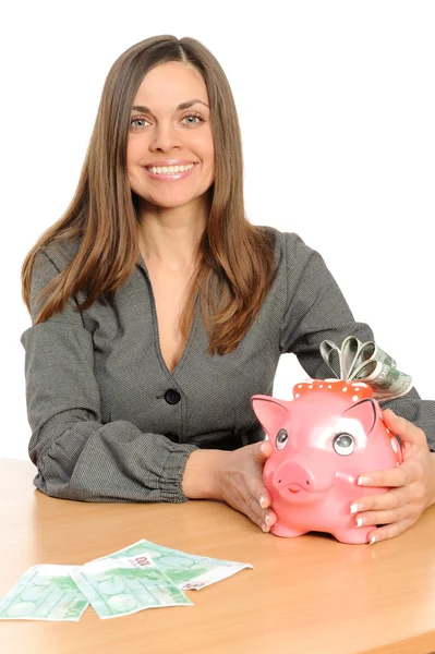 Business woman with a piggy bank — Stock Photo, Image