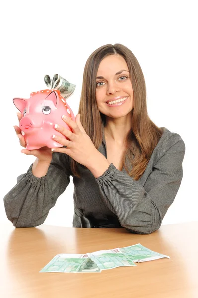Mulher de negócios com um banco porquinho — Fotografia de Stock