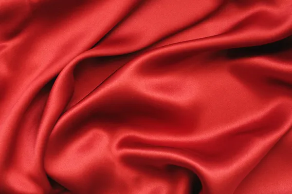 Красный шелк текстильный фон — стоковое фото