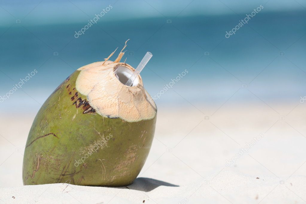 Coconut drink with pipe on the caribbean