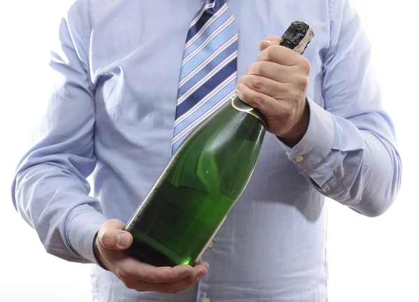 Businessman with bottle of Champagne Stock Picture