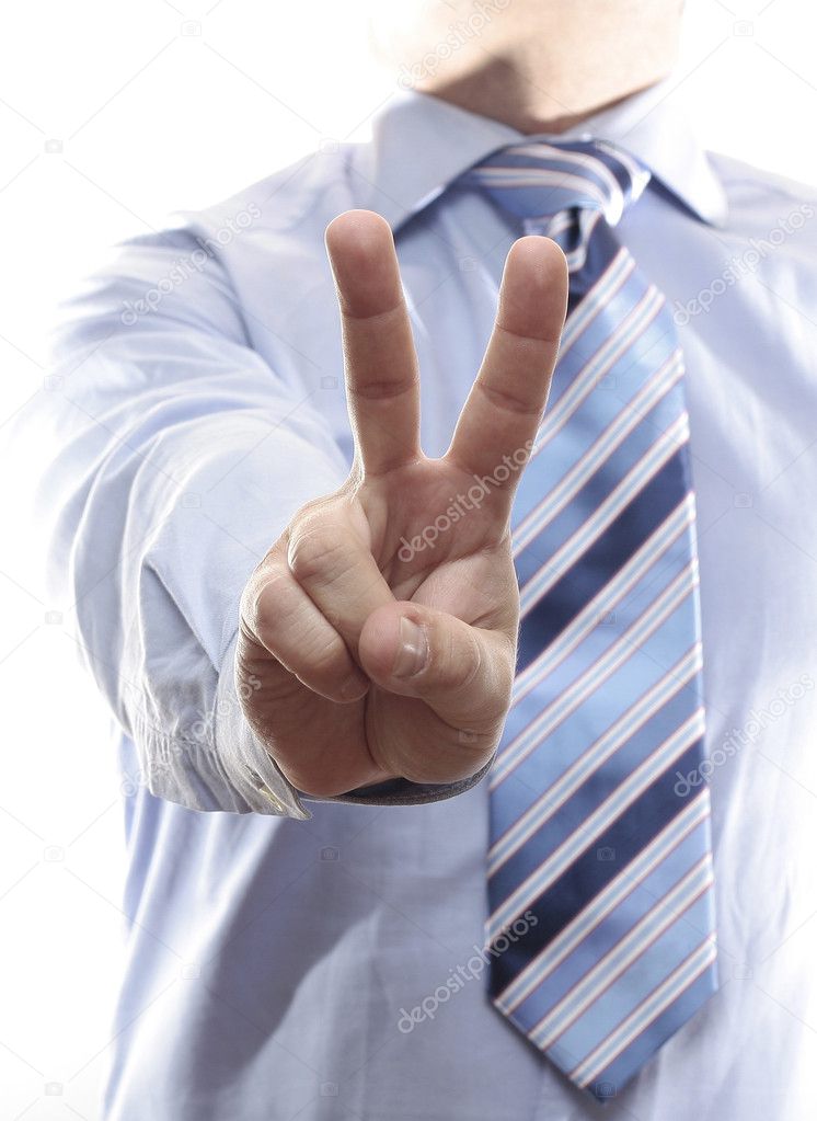 Businesman giving the Victory sign.