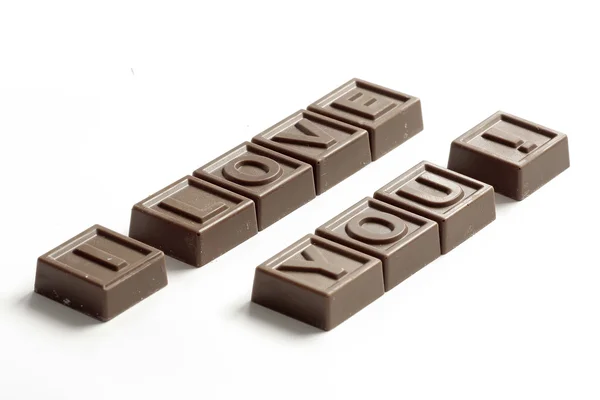 Word Love made of little chocolates — Stock Photo, Image