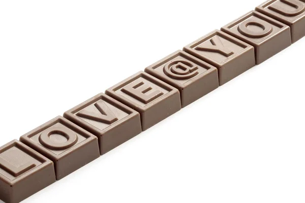 Word Love made of little chocolates — Stock Photo, Image