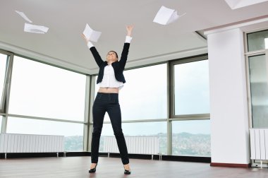 Young business woman throw papers in air clipart