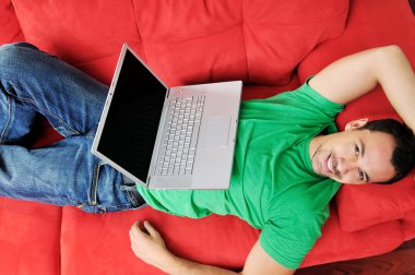 Young man working at home clipart