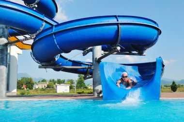 Water slide fun on outdoor pool clipart