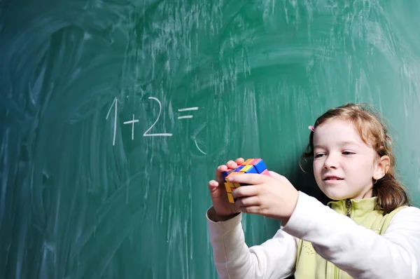 Happy school girl on math classes — Stock Photo, Image