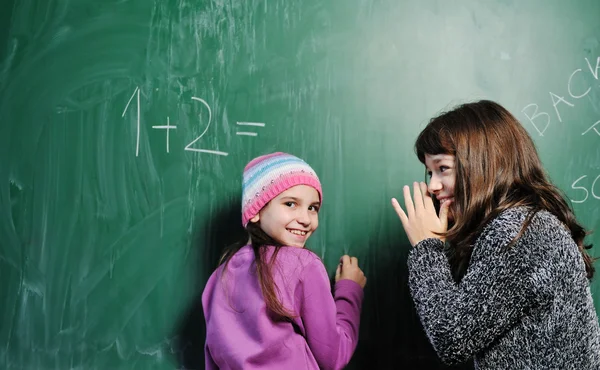 Happy school girl on math classes — Stock Photo, Image