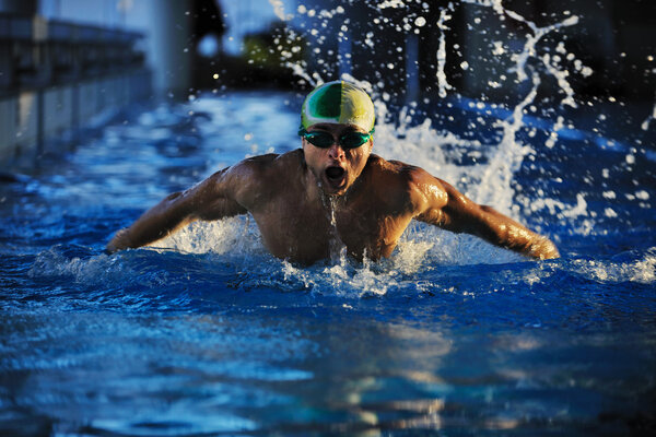  swimmer recreating on olimpic pool