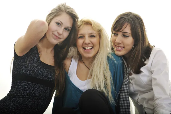 Három fiatal lány, elszigetelt fehér — Stock Fotó