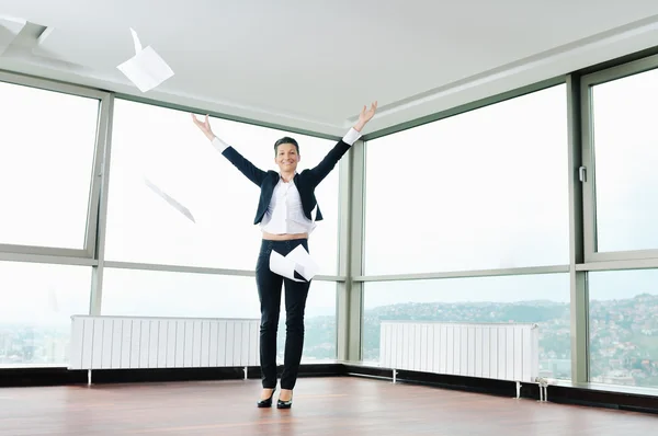 Young business woman throw papers in air — Stock Photo, Image