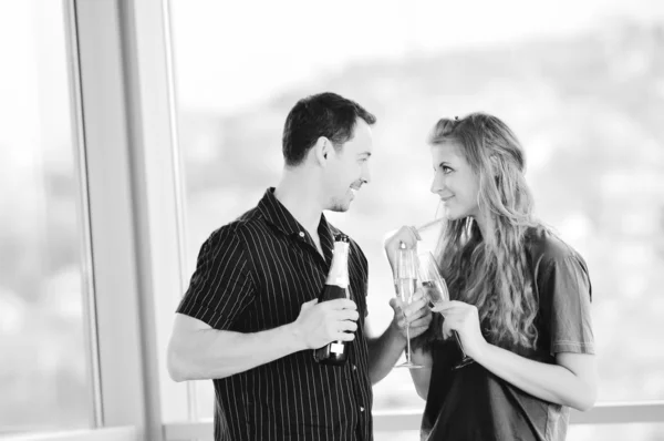 Happy couple with glasses of champagne — Stock Photo, Image
