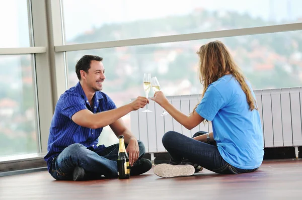 Happy couple with glasses of champagne — Stock Photo, Image