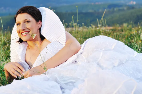 Beautiful bride outdoor after wedding ceremony — Stock Photo, Image