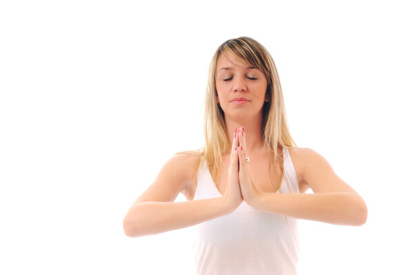 One young fit woman in white shirt meditating and exercise yoga isolated