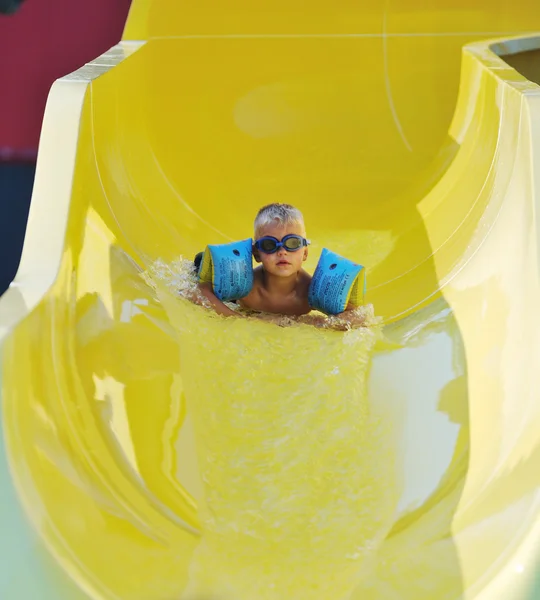 Water slide fun on outdoor pool — Stock Photo, Image