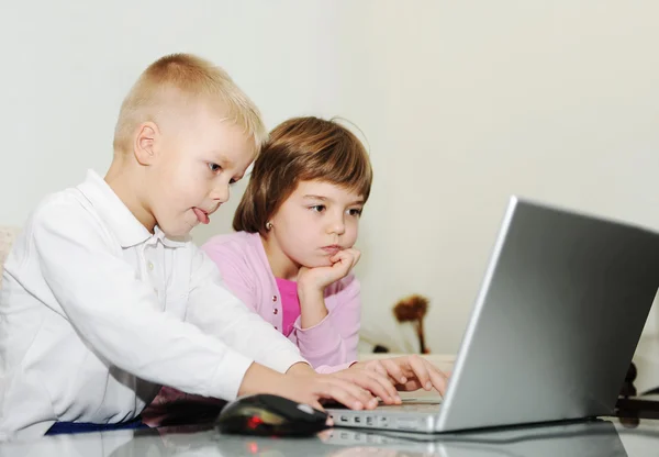 Two happy children playing games — Stock Photo, Image