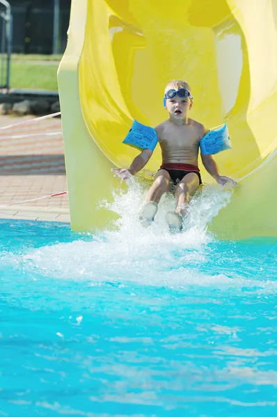 Water slide fun on outdoor pool Stock Image