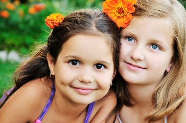 Two happy girls have fun outdoor clipart