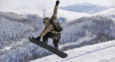 Freestyle snowboarder jump and ride clipart