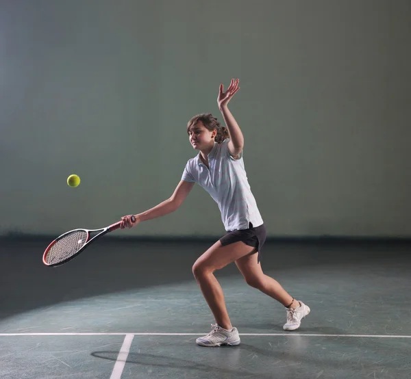 Young girls playing tennis game indoor — Stock Photo, Image