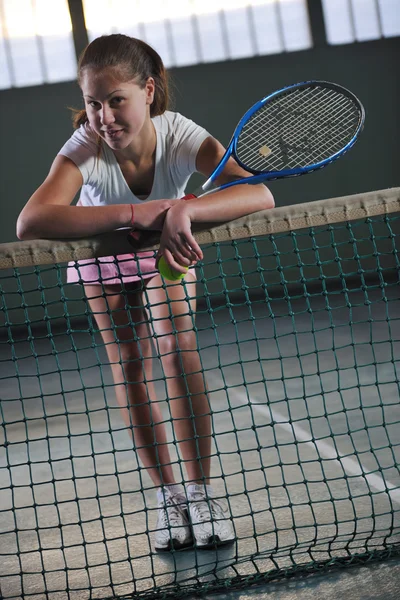 Young girls playing tennis game indoor — Stock Photo, Image