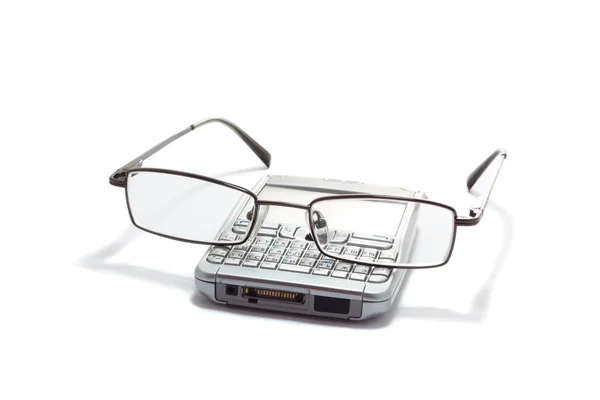 Glasses on mobile phone — Stockfoto