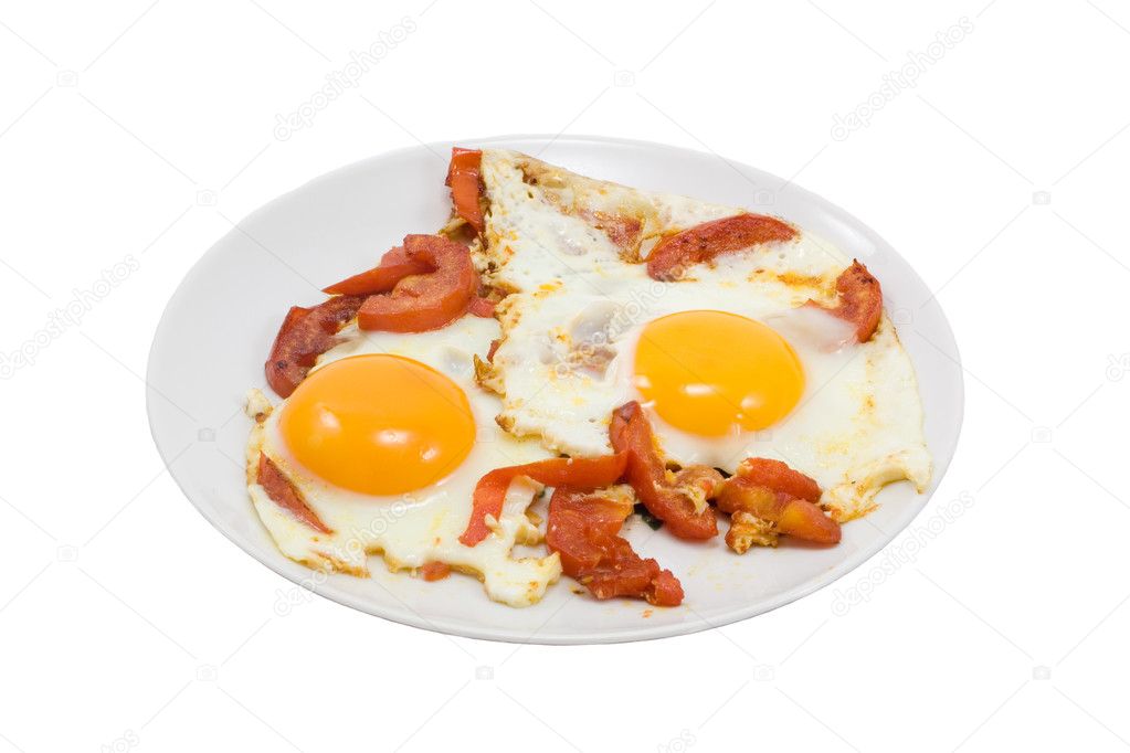 Fried eggs with tomatos on white