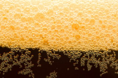 Close-up dark beer with foam clipart