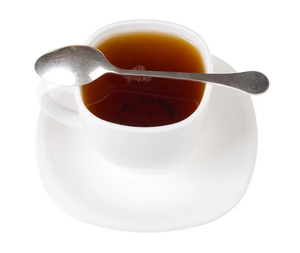 Cup and spoon with black tea — Stock Photo, Image