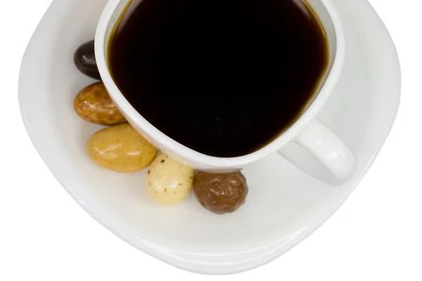 Чашка кофе с конфетами — стоковое фото