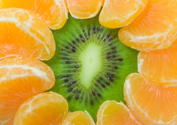 Kiwi a mandarinky pozadí — Stock fotografie