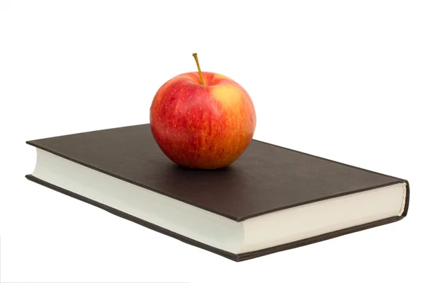 Red apple on book — Stock Photo, Image