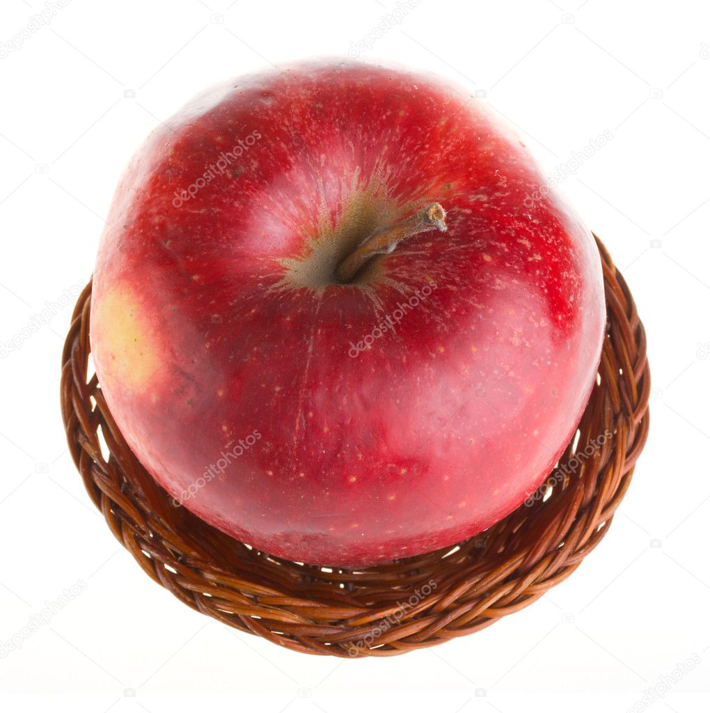 Red apple in basket view from above