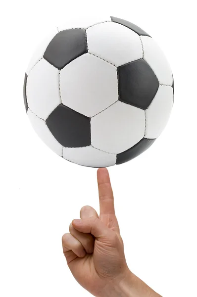 Soccer ball at finger — Stock Photo, Image