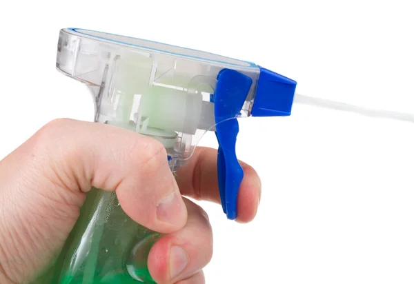 Spray bottle in hand with stream — Stock Photo, Image