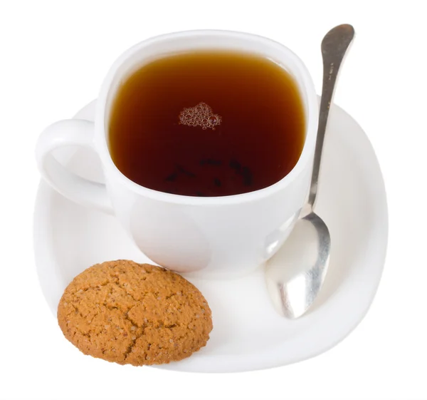 Tea and spoon with cookie — Stock Photo, Image