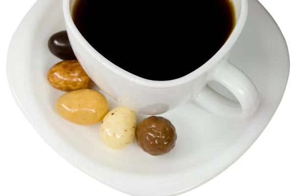 White cup of coffee with candies — Stock Photo, Image