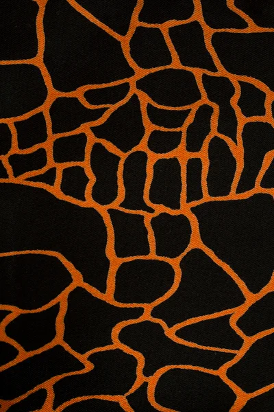 stock image Black fabric cloth with orange pattern