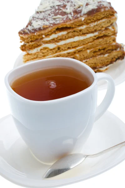 Black tea cup and piece of honey cake — Stock Photo, Image