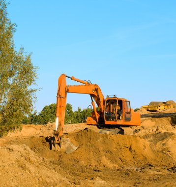 Excavator on gravel clipart