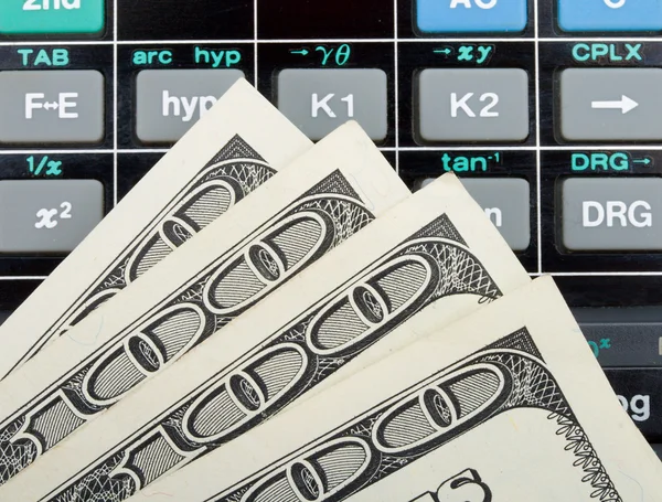 Dollars over calculator — Stock Photo, Image