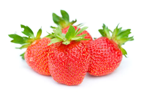 Four ripe strawberries — Stock Photo, Image