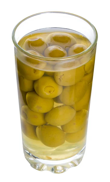 Glas mit grünen Oliven — Stockfoto