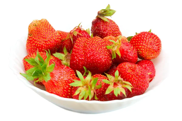 Många jordgubbar på tallrik — Stockfoto