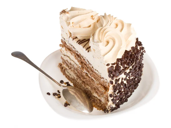 Piece of cake on white plate with spoon — Stock Photo, Image