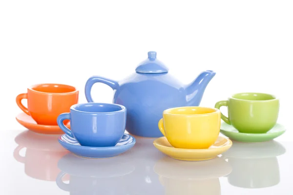 Чайник и четыре кубка набор — стоковое фото