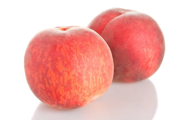 Два персика — стоковое фото